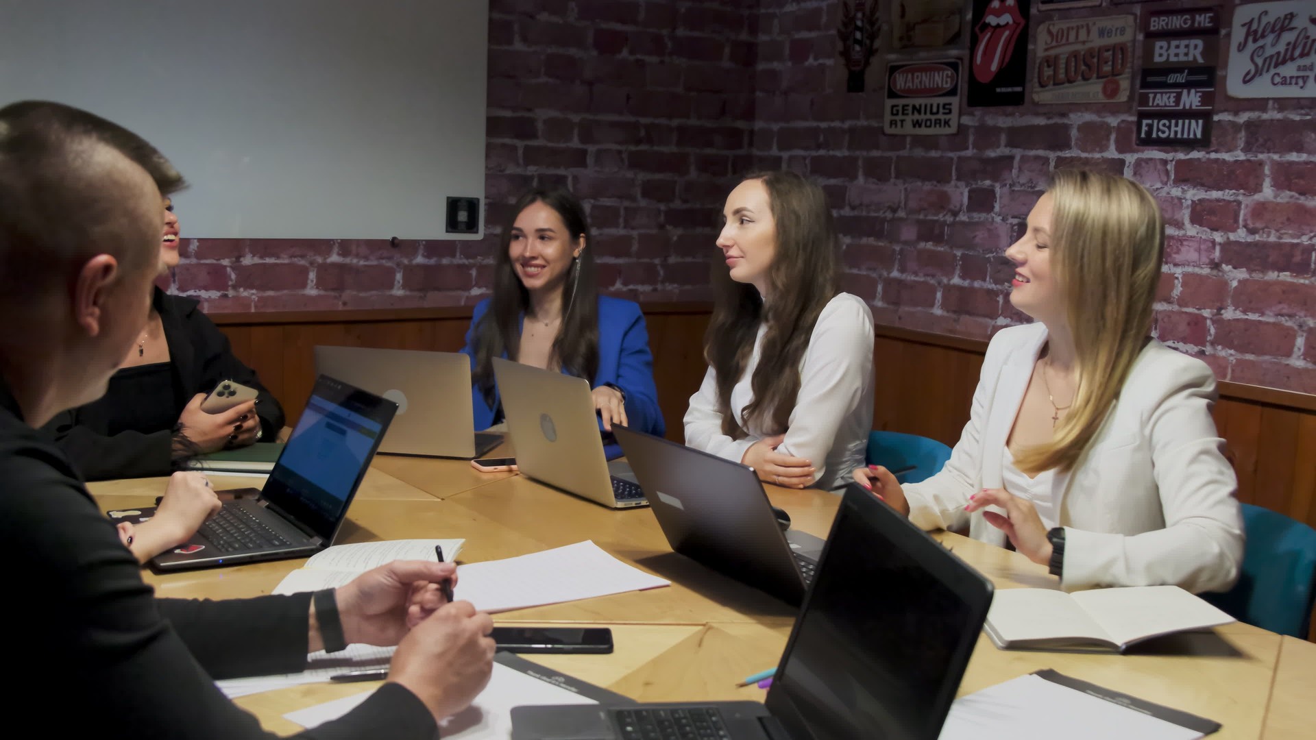 Busy colleagues in formal clothes discuss new project